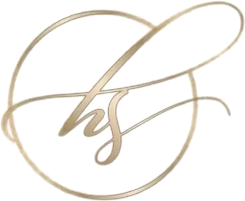 The Hera Studio monogram: the letters h and s in gold script inside a gold ring